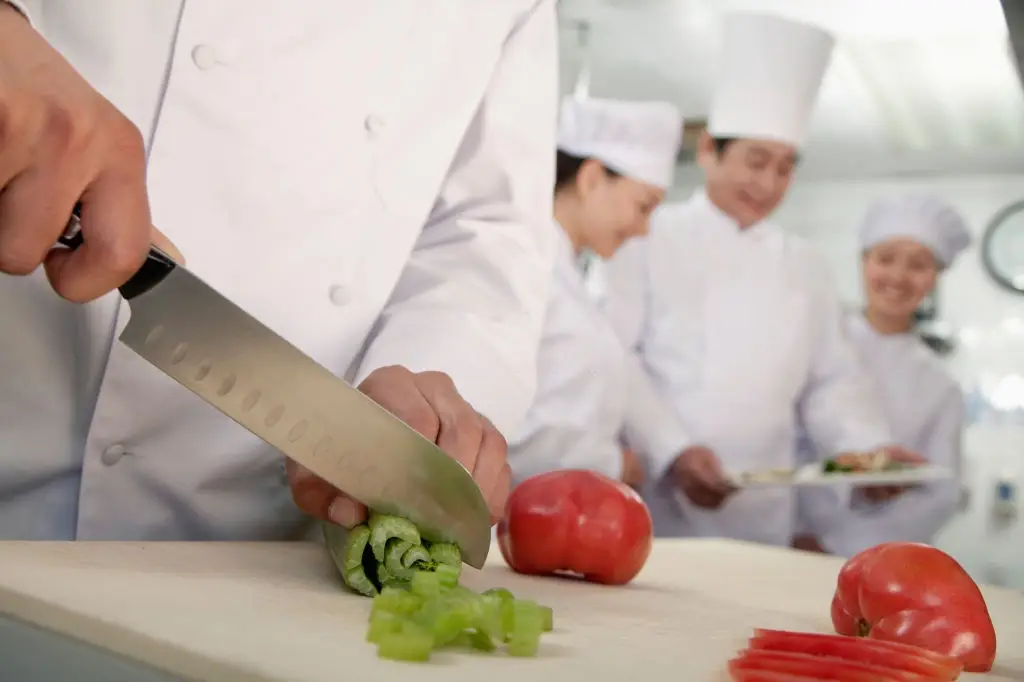 Chinese chef slicing vegetables